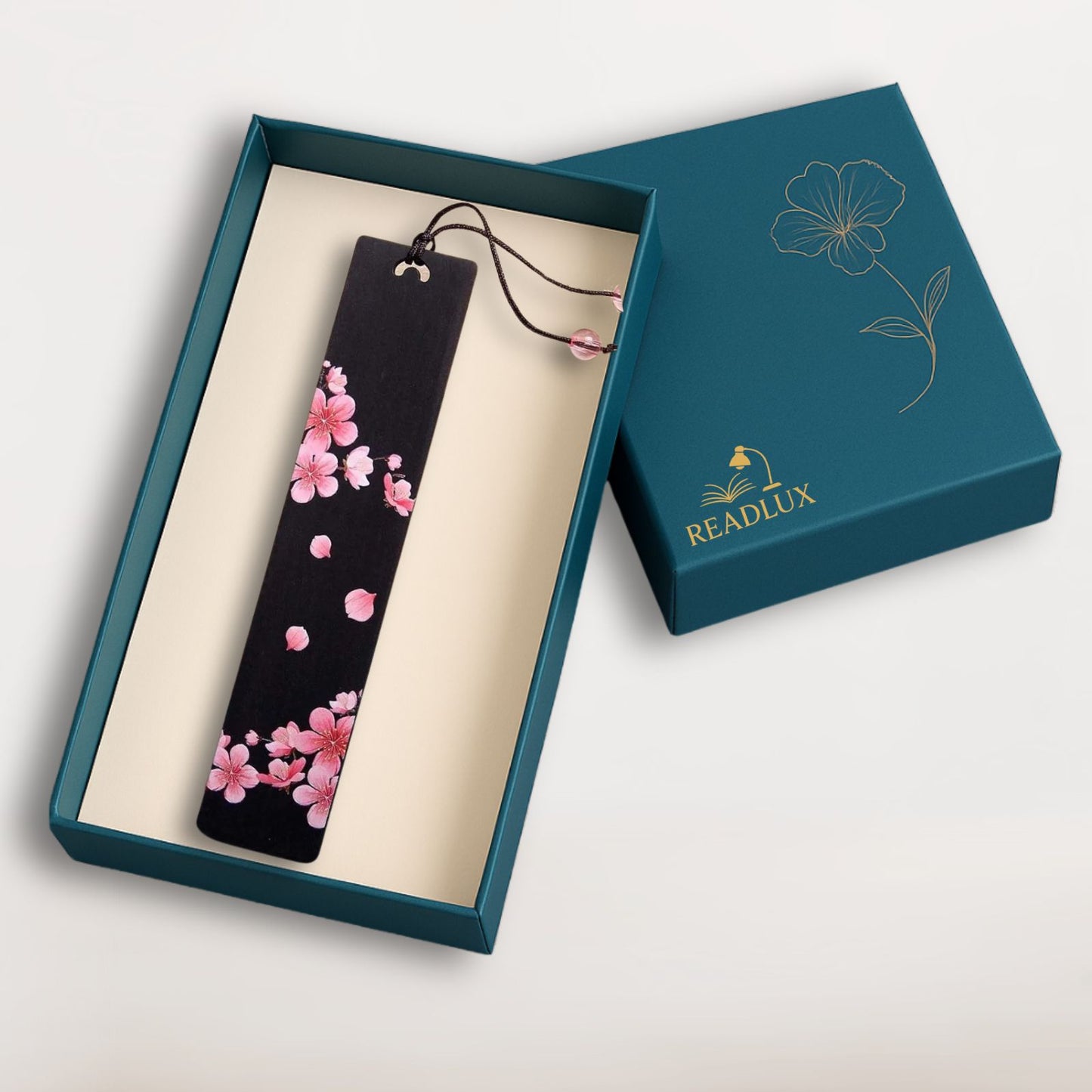 Marque page bois sombre avec fleurs de cerisier roses et cordon perlé, signé Readlux