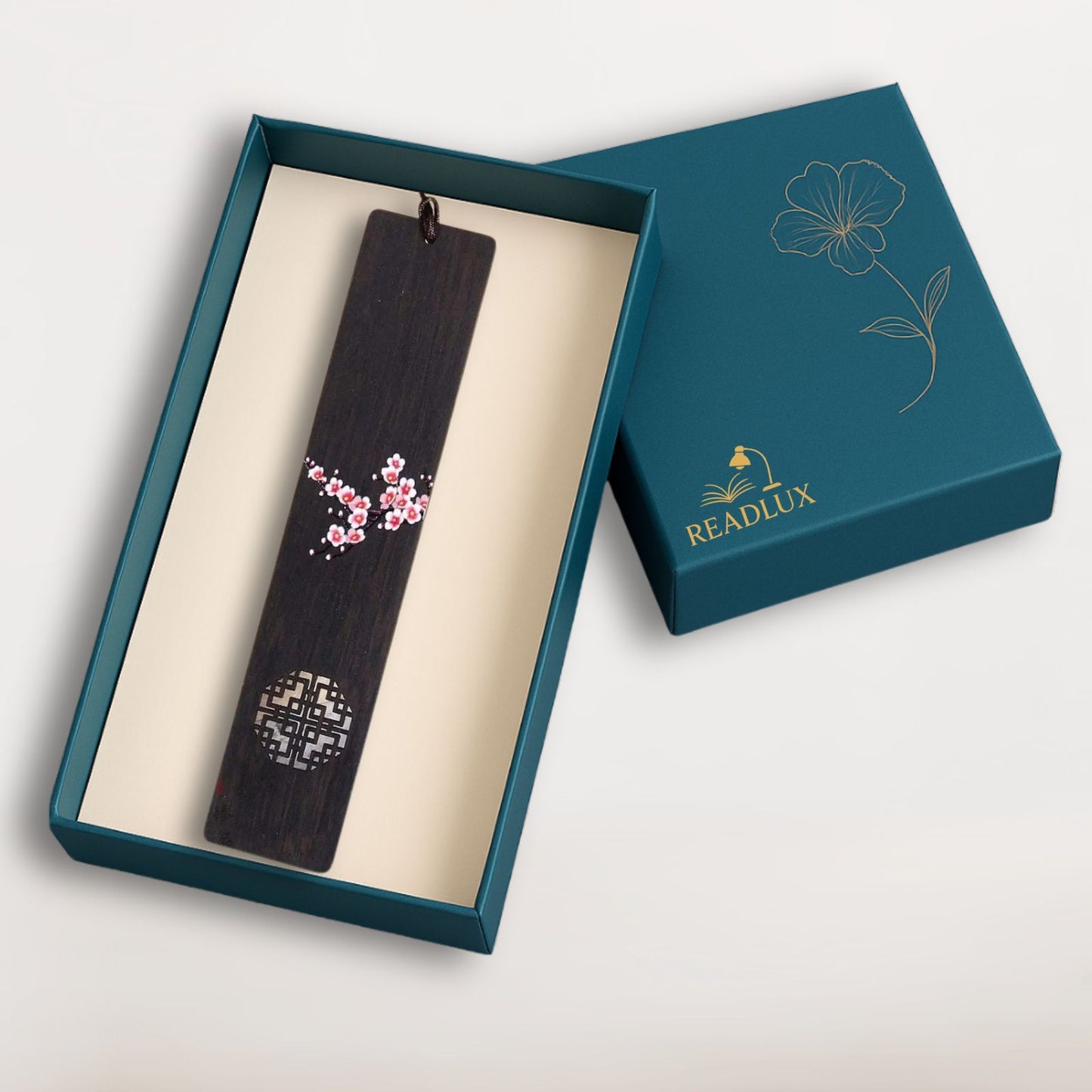 Marque page bois sombre avec motif floral de cerisier et découpe géométrique, signé Readlux