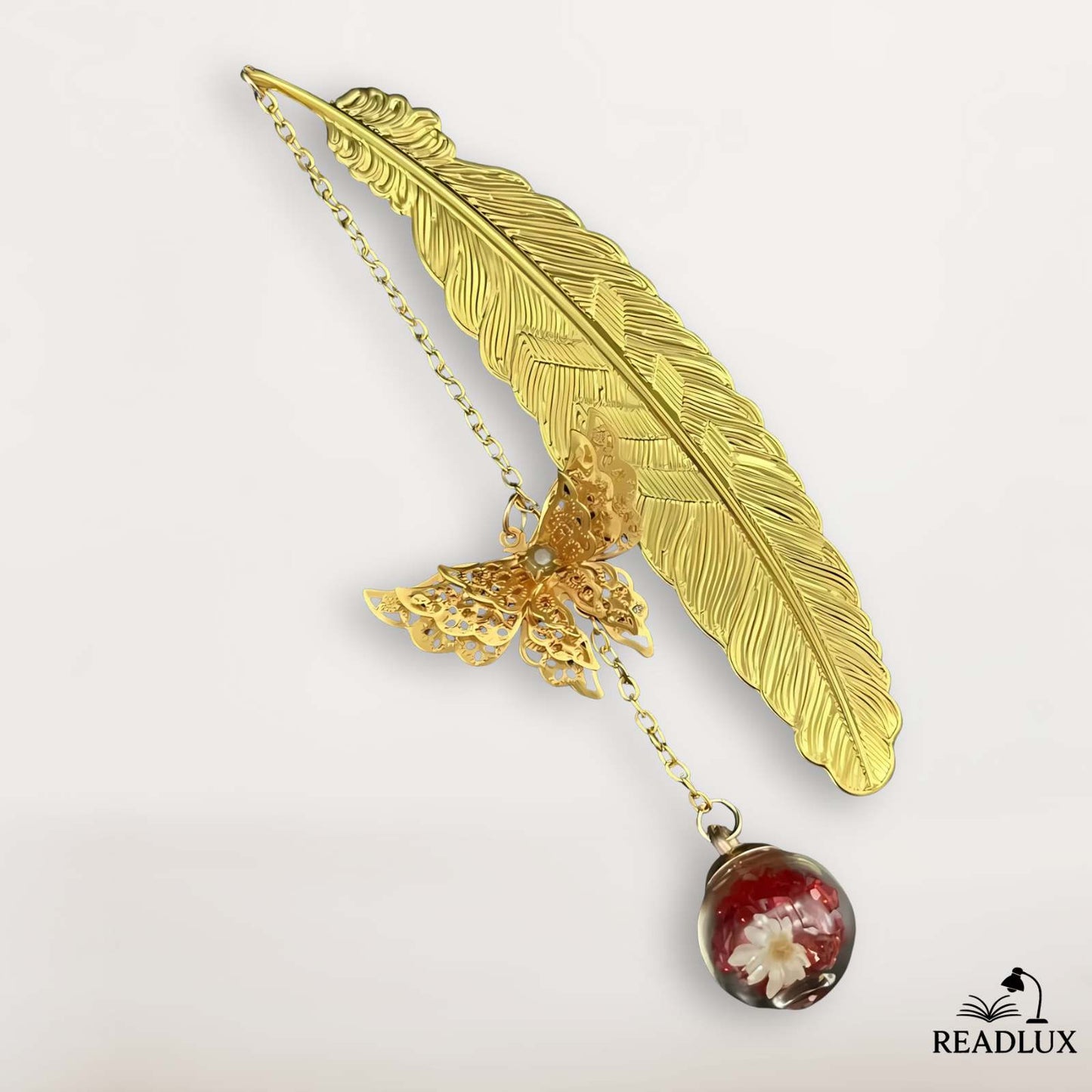 Marque page en forme de plume dorée avec pendentif boule fleurs séchées, style poétique