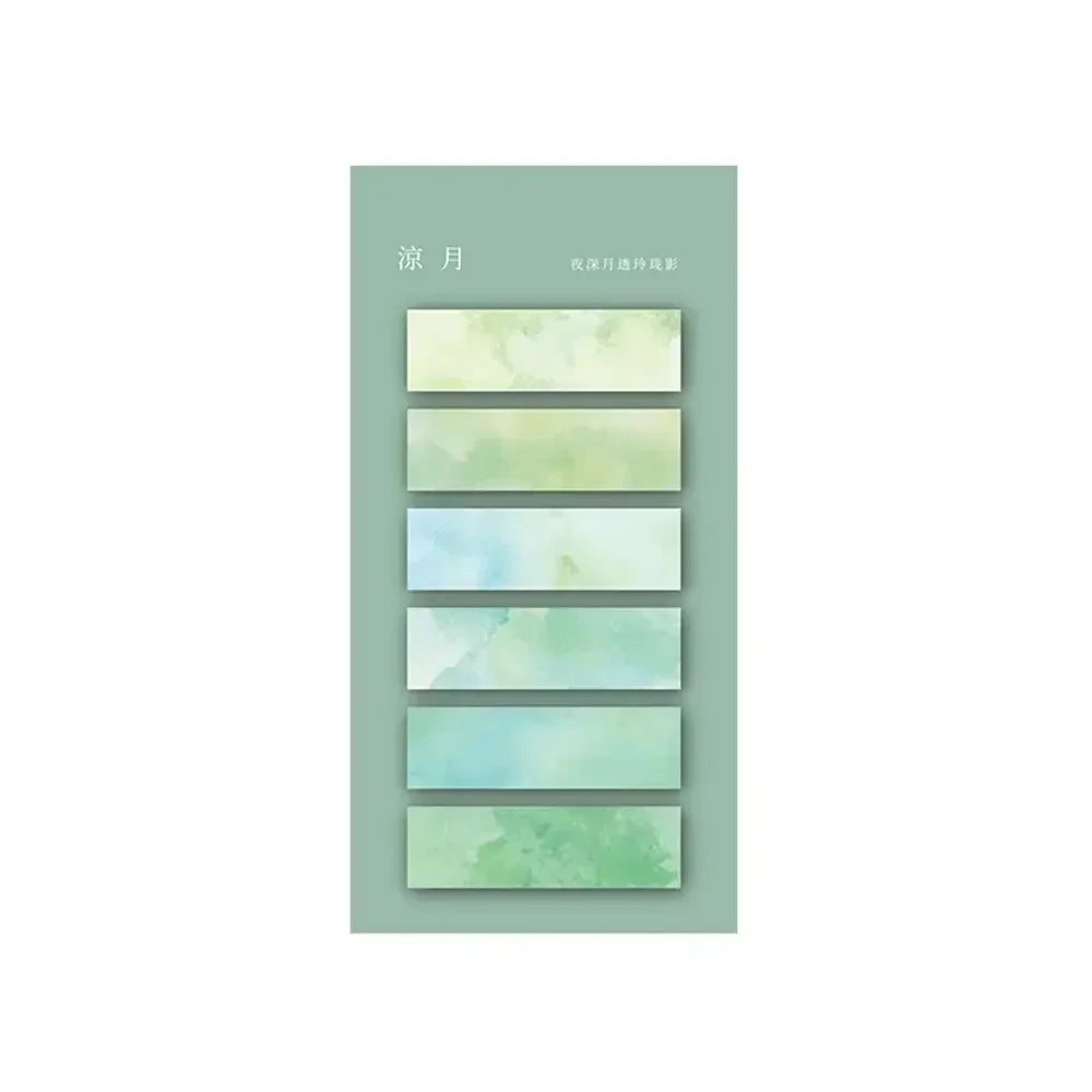 Cinq onglets autocollants transparents aux dégradés de vert et bleu, présentés sur un fond vert pastel