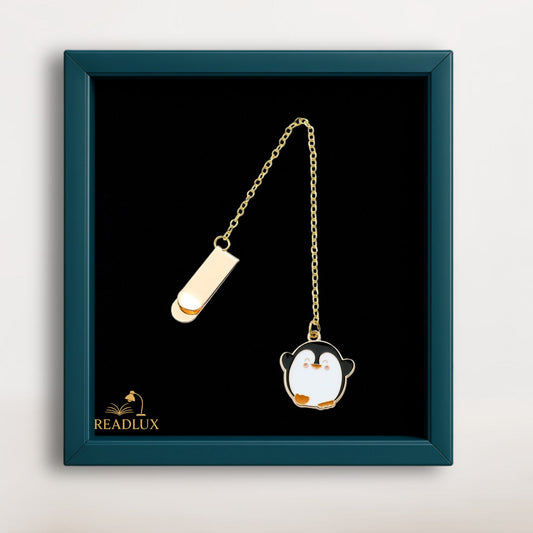 Bijou marque page doré avec pendentif pingouin émaillé noir et blanc, compagnon polaire pour roman ou carnet.