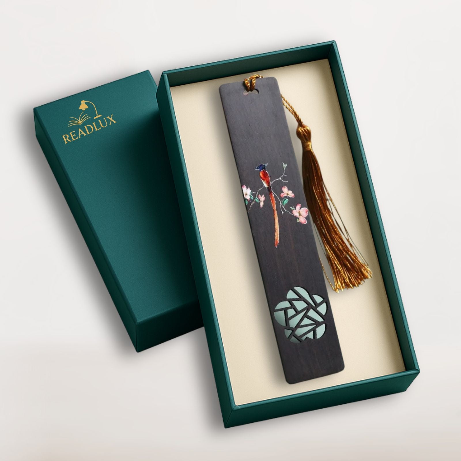 Marque page bois sombre avec motif d'oiseau et de fleurs, pompon doré élégant, signé Readlux
