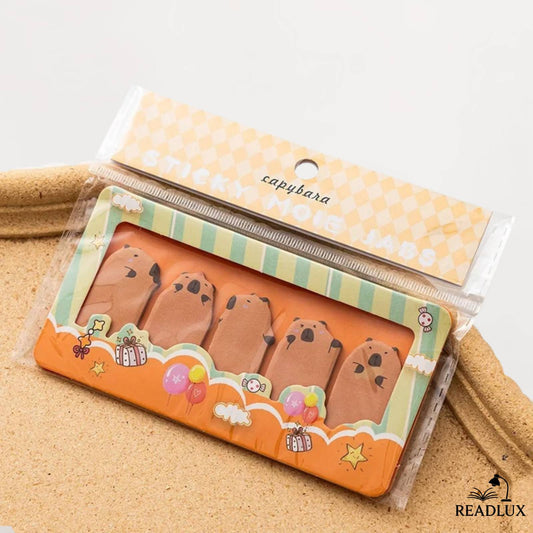 Bloc marquepage kawaii capybara sur fond orange, 150 onglets parfaits pour noter ou relire.